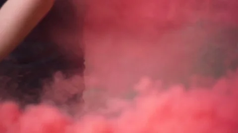 Man Holding Red Smoke Grenade Stock Footage 81550663