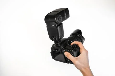 Man holding reflex camera with on-camera flash  Stock-Fotos