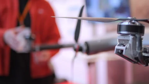Man is holding a remote control and looking at a propeller Video stock 311394816
