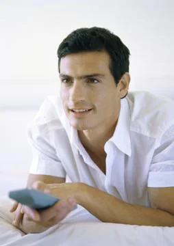 Man holding remote control Stock Photos