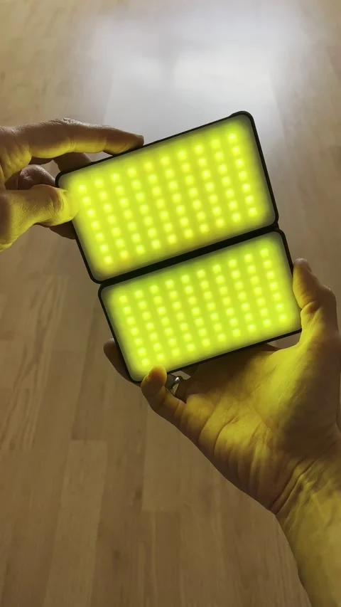 Man holding rgb led panel for video filming Stock Footage 237761905