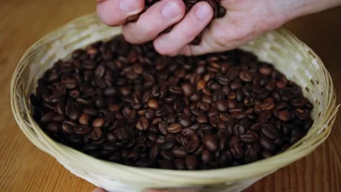 Man holding roasted coffee beans in hand Stock-Footage 150402327