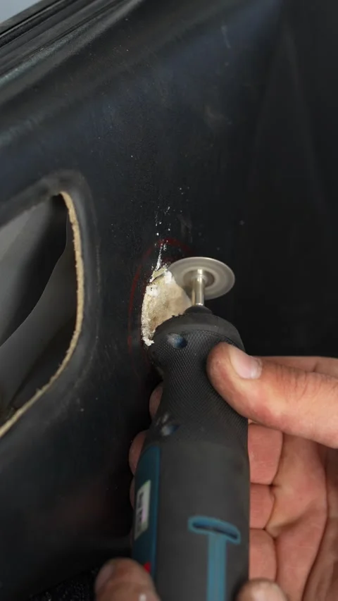 Man holding a rotary tool with a cutting disc blade. Stock Footage 344364845