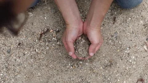 Man holding sand Stock Footage 141890874