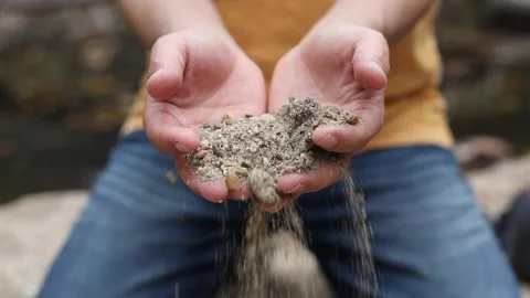 Man holding sand Stock Footage 141890946
