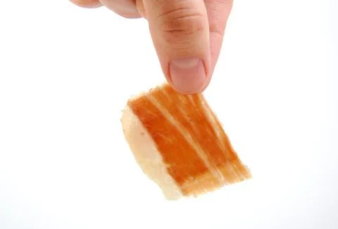 Man holding a serrano ham slice. Jabugo. Spanish tapa Stock Photos
