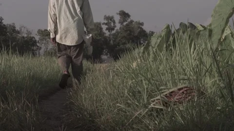 Man holding sickle Stock Footage 154917982