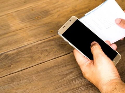 A man holding smart phone for using online banking app for paying credit card Stock Photos