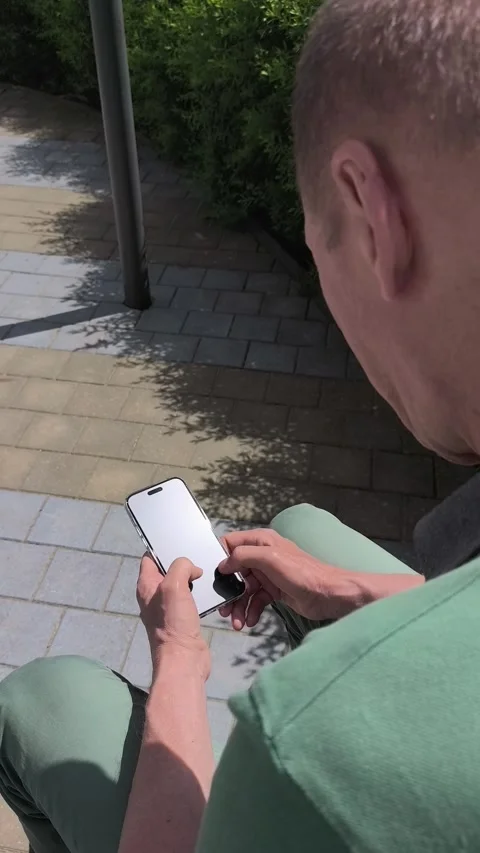 Man holding smartphone, abstract mobile phone app using. Male user from beh.. Stock Footage 337171980