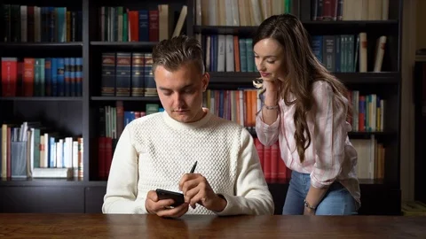 Man holding smartphone and using pen for registering data Stock-Footage 108586733