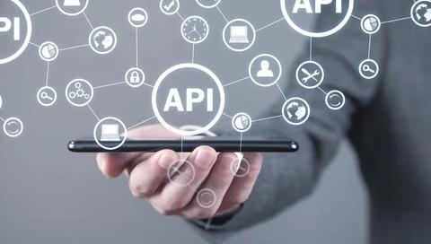 Man holding smartphone. API. Application Programming Interface. Software Deve Stock Photos