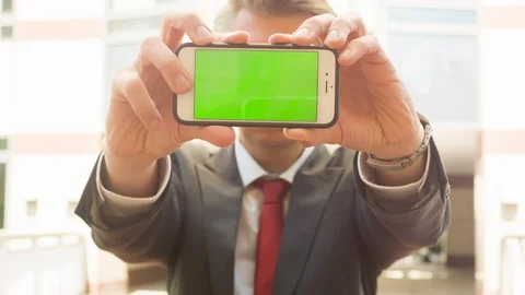 A man holding a smartphone to the camera Video stock 104321559