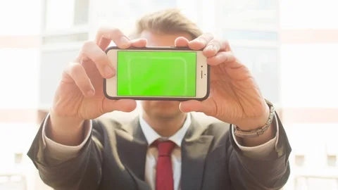 A man holding a smartphone to the camera Video stock 104321850