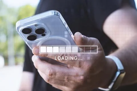 Man holding a smartphone with a digital loading bar and progress indicator .. Stock Photos