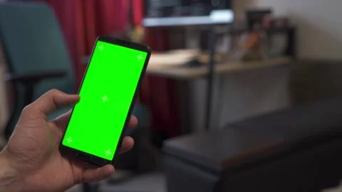 Man holding smartphone with green screen Stock Footage 201486295