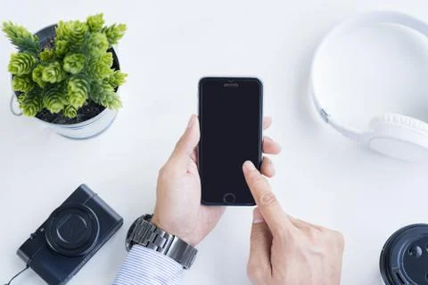Man holding a smartphone Stock Photos