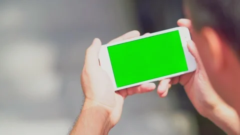 Man holding a smartphone reading a message Stock Footage 112152566