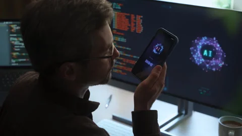 Man holding smartphone, talking with AI chatbot app Stock Footage 341679572
