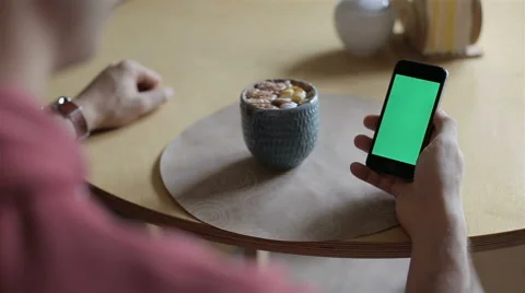 Man Holding Smartphone Touch Screen With Green Screen Chroma Key Stock Footage 68978948