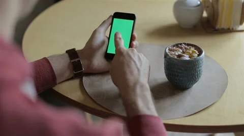 Man Holding Smartphone Touch Screen With Green Screen Chroma Key Stock Footage 68978958