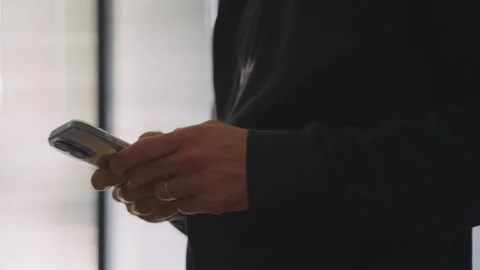 Man holding smartphone typing message on digital keyboard sending email Stock Footage 331404754