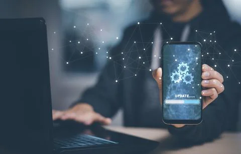 Man holding Smartphone with Update Software Computer Program Upgrade Business Stock Photos