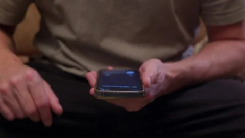 Man holding smartphone while waiting, close up hands view Stock-Footage 336746302