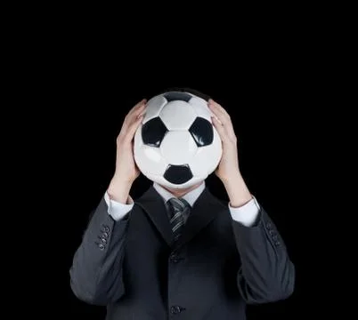 Man holding a soccer ball in front of his face. Football world cup Stock Photos