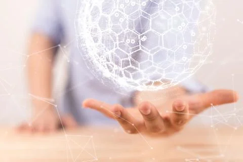 Man holding a sphere with interconnected polygons. concept of a global digital t Stock Photos