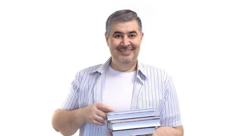 Man Holding Stack of Books and Smiling at the Camera Stock Photos