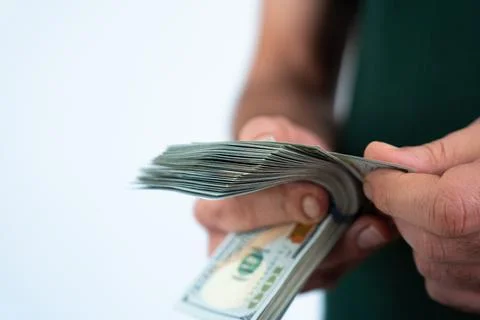 Man holding stack of cash in hands Stock Photos