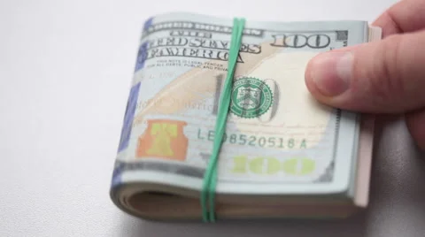 Man is holding stack of dollars in his hand Stock Footage 43564779