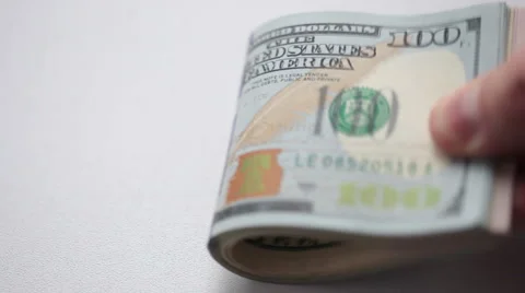 Man is holding stack of dollars in his hand Stock Footage 43564825