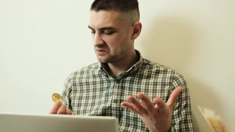 Man holding a stack of euro banknotes and a bitcoin coin, then throwing away the Stock Footage 330895755