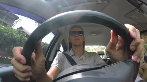 Man Holding Steering Wheel While Driving Car. 4K Stock Footage 65678423