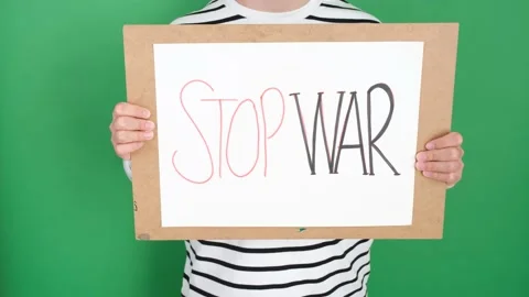 Man holding stop war protest poster Stock Footage 236457798
