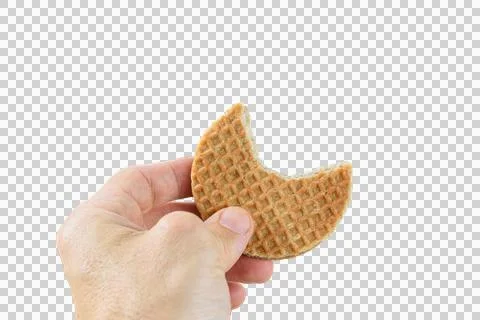 Man holding a stroopwafel cookie with a bite (PNG). Stock Photos