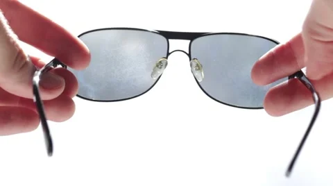 Man holding sunglasses in hands Vídeo Stock 66755859