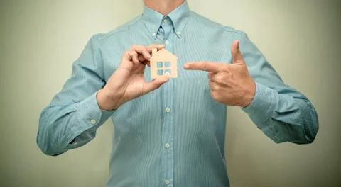 Man holding a symbol of house purchase 스톡 사진