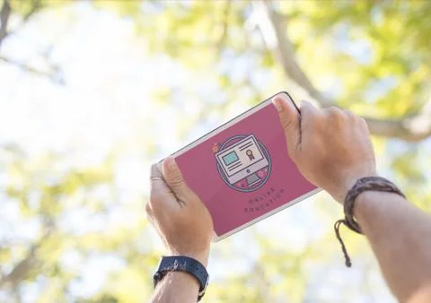 Man holding a tablet with e-learning information in the screen Stock Photos