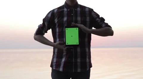 Man holding a tablet with a green screen 스톡 동영상 55338035