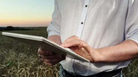 Man is holding a tablet in his hand Stock Footage 316709114