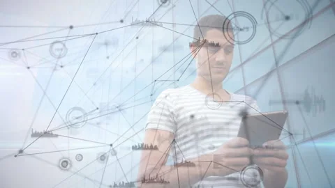Man holding tablet interacting with network nodes overlay, showcasing technology Stock Footage 307483058