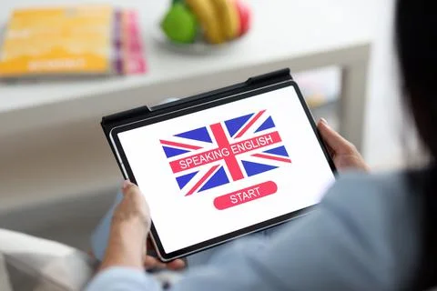 Man holding a tablet with a language learning program Foto stock