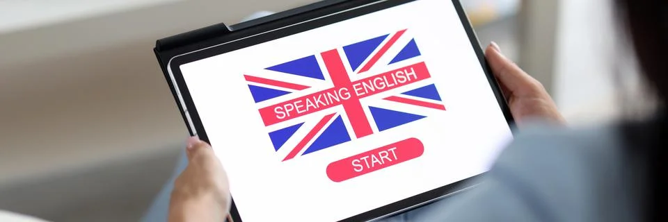 Man holding a tablet with a language learning program Foto stock