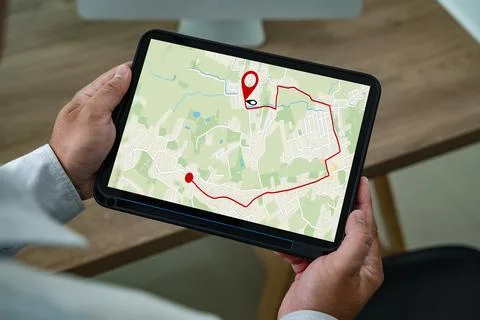 Man holding tablet with navigation app showing GPS map and route, modern di.. Stock Photos
