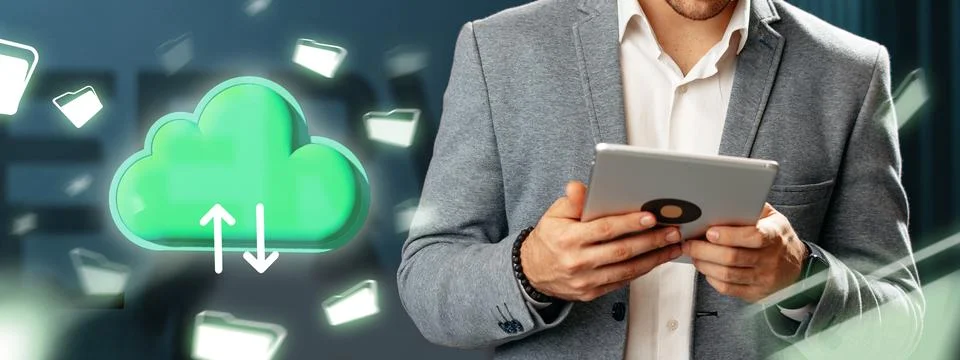 Man holding tablet while using cloud storage service on modern background in Stockfoto's