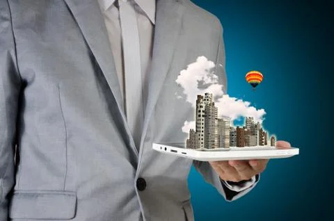 Man holding touch screen tablet and city Stock Photos