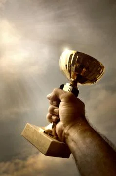 Man holding up the trophy Stock Photos