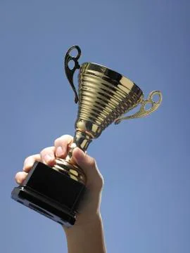 Man holding trophy Stock Photos